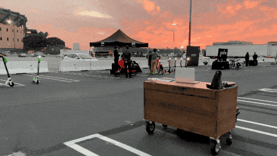 Gray Motorized Desk Self driving autonomous driving desk going along with sunset in background animated GIF