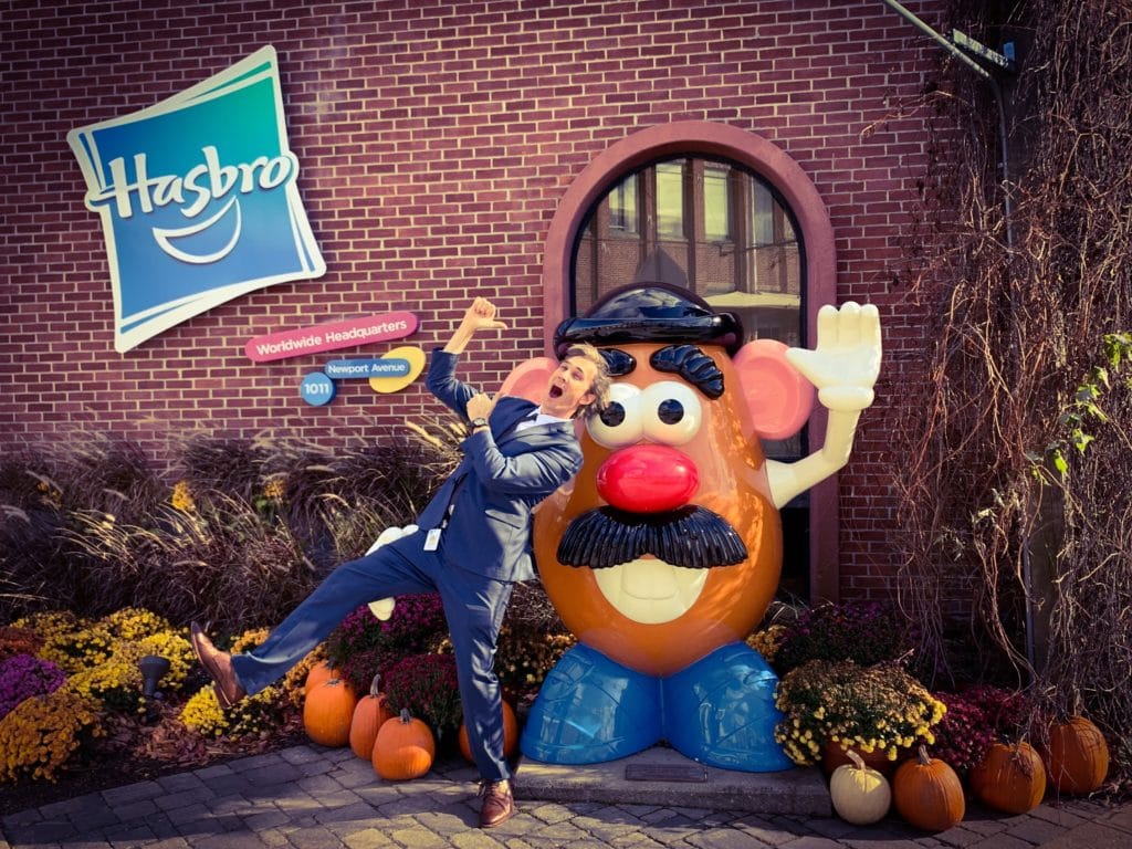 Gray Bright dancing out front of Hasbro Head Office in Pawtucket, Rhode Island with Mr Potato Head in a suit.