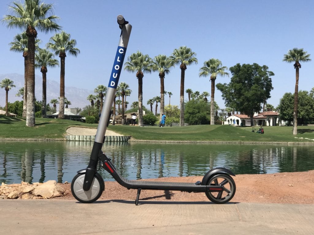 Cloud Scooter standing by a lake in Palm Springs