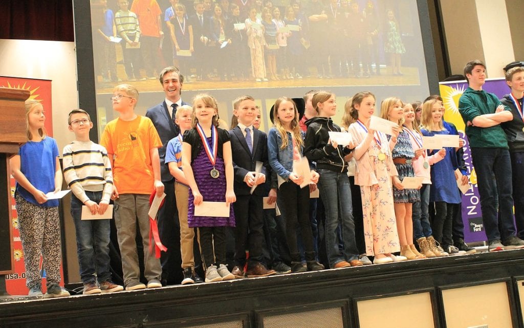 Invention Convention Idaho 2020 with contestants and emcee and host Gray Bright on stage
