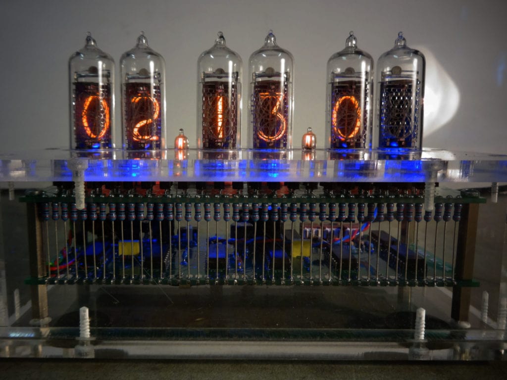 Front of Nixie Tube with 02:12:0 shown in the display with resistors and PCB