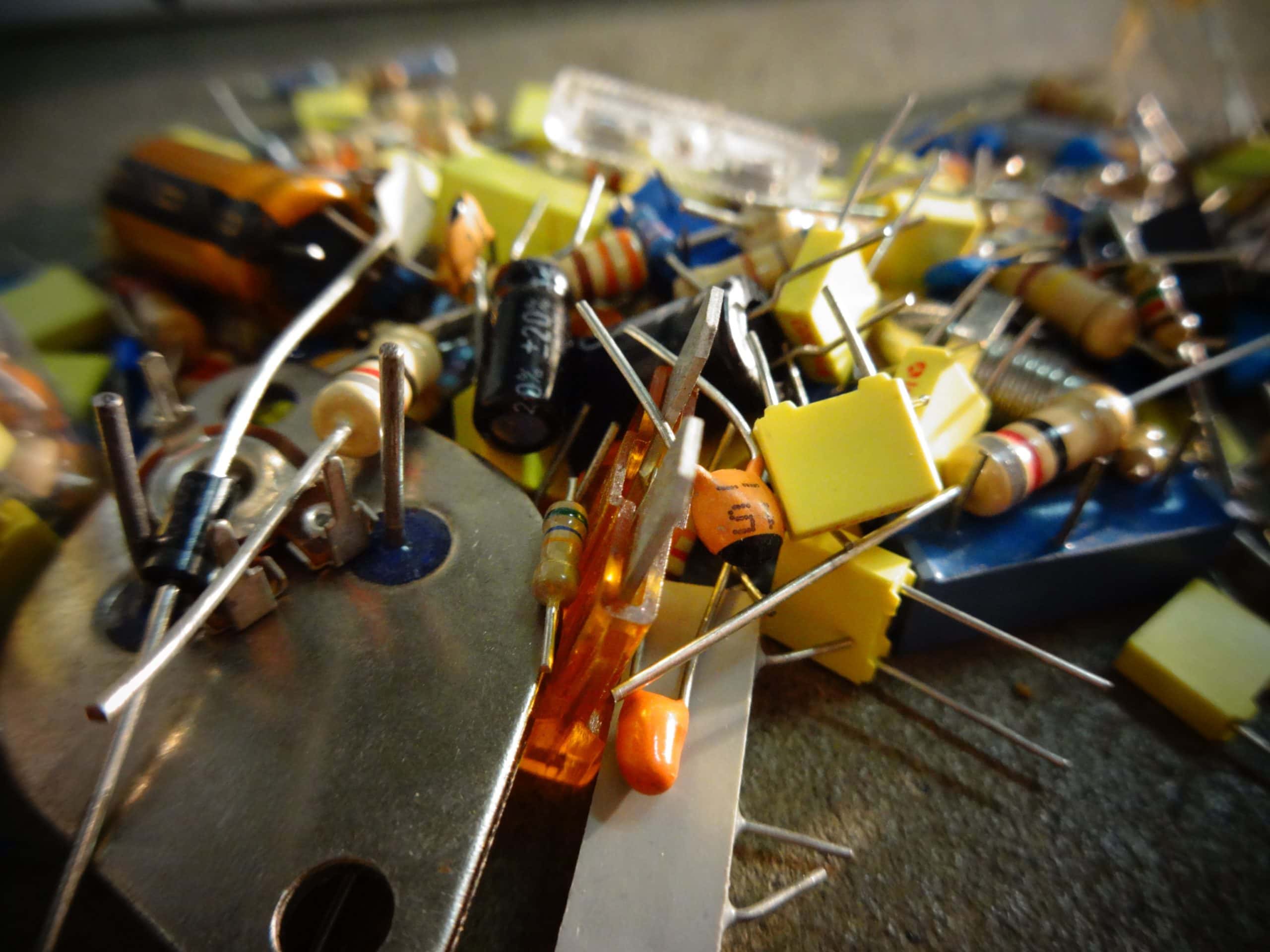 Close up of many different components including resistors and capacitors