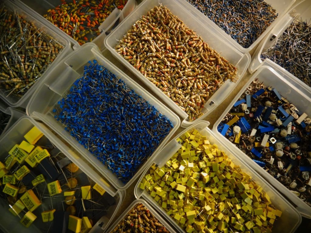 Tubs of Robot Body Parts with capacitors, resistors, and more - top view