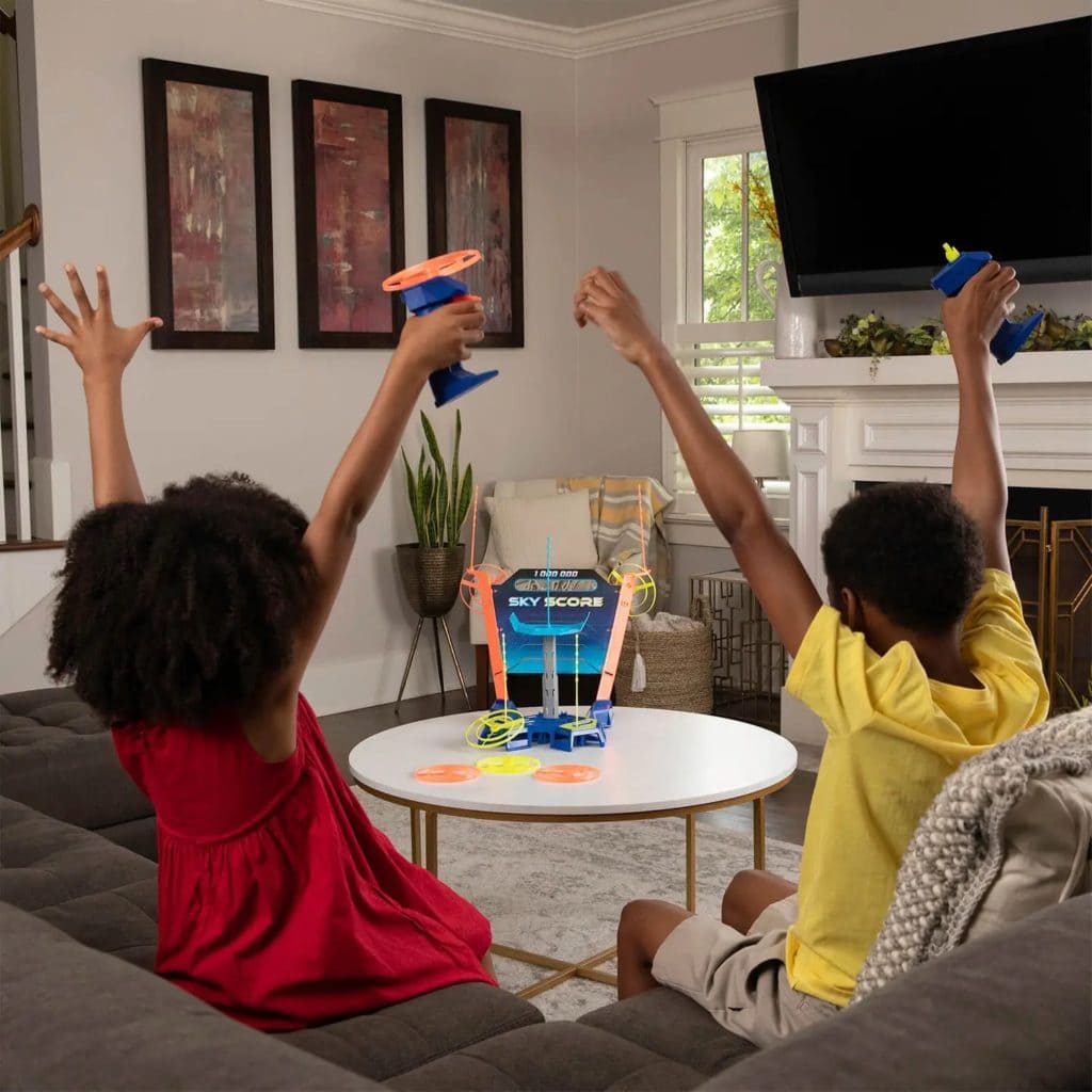 Sky Score Game Hasbro kids in lifestyle shot playing the game and celebrating
