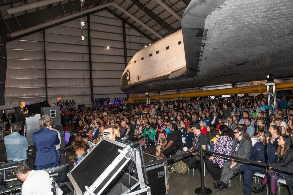 Yuri's Night Crowd with the Space Shuttle Endeavour in the background while Bill Nye is on stage
